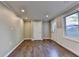 Bright living room with wood floors, recessed lighting, and neutral walls at 1723 Woodbow Path, Dacula, GA 30019