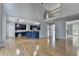 Spacious living room open to the kitchen and featuring a view of the upstairs landing at 1723 Woodbow Path, Dacula, GA 30019