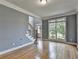 Open living room area featuring hardwood floors, and large bay window at 1723 Woodbow Path, Dacula, GA 30019