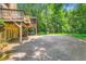 Spacious backyard featuring a patio area and a swing set nestled among mature trees at 350 Lamplighter Se Ln, Marietta, GA 30067