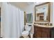 Bathroom with vanity, shower, mirror, tile accents, and soft neutral color palette at 350 Lamplighter Se Ln, Marietta, GA 30067