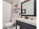 Modern bathroom featuring a sleek vanity with matte black hardware and a framed mirror at 350 Lamplighter Se Ln, Marietta, GA 30067