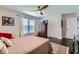 Bedroom with hardwood floors, a ceiling fan, a patterned rug, and a double closet at 350 Lamplighter Se Ln, Marietta, GA 30067