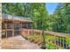 Beautiful outdoor deck surrounded by lush greenery and well manicured landscaping at 350 Lamplighter Se Ln, Marietta, GA 30067