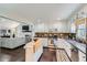 Well-lit kitchen with white cabinetry, stainless steel appliances, and view to living room at 350 Lamplighter Se Ln, Marietta, GA 30067