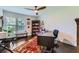 Bright home office with hardwood floors, a ceiling fan, large windows, and a wooden desk at 350 Lamplighter Se Ln, Marietta, GA 30067