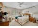 Cozy bedroom featuring natural light, a ceiling fan, and neutral decor with floral accents at 4063 Penhurst Dr, Marietta, GA 30062