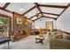 Comfortable living room with a brick fireplace and large windows overlooking the deck at 4063 Penhurst Dr, Marietta, GA 30062