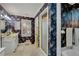 Detailed bathroom showcasing unique wallpaper, walk-in shower, soaking tub, and large vanity at 4063 Penhurst Dr, Marietta, GA 30062