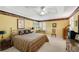 Spacious bedroom with tray ceilings, large windows, and a cozy seating area at 4063 Penhurst Dr, Marietta, GA 30062