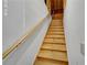 A wooden staircase with a light-colored handrail stands against a freshly painted white wall at 4063 Penhurst Dr, Marietta, GA 30062