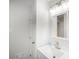 Bright bathroom featuring a sink with a modern vanity and a decorative vanity light at 4601 Lindsey Dr, Powder Springs, GA 30127
