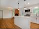 Bright kitchen with modern appliances, white cabinets, and center island at 4601 Lindsey Dr, Powder Springs, GA 30127