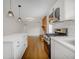 Modern kitchen with stainless steel appliances, white cabinets and an island with white countertops at 4601 Lindsey Dr, Powder Springs, GA 30127