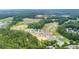 Aerial view of home sites nestled among trees, offering privacy and serenity at 104 Crooked Lake Park, Villa Rica, GA 30180