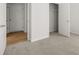 Bedroom with plush carpet, an entry door and view into the closet at 104 Crooked Lake Park, Villa Rica, GA 30180