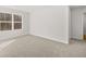 Bedroom with plush carpeting and a bright window offering a view of the exterior at 104 Crooked Lake Park, Villa Rica, GA 30180