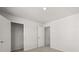 Bedroom featuring neutral walls and carpet with closet and bedroom doors at 104 Crooked Lake Park, Villa Rica, GA 30180