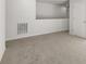 Hallway features neutral walls and carpet leading to an upstairs loft or flex space at 104 Crooked Lake Park, Villa Rica, GA 30180