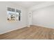 Bright room with hardwood floors, white walls, large window, and white trim at 104 Crooked Lake Park, Villa Rica, GA 30180