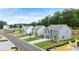 Street view showcasing newly built homes with manicured lawns in a modern residential neighborhood at 104 Crooked Lake Park, Villa Rica, GA 30180