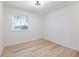 Bedroom with natural light, wood-look flooring, and serene view from window at 4059 Big Valley Trl, Stone Mountain, GA 30083