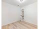 A bright, modern bedroom with wood-look floors and an open doorway to an adjacent room at 4059 Big Valley Trl, Stone Mountain, GA 30083