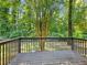 Spacious wooden deck, surrounded by lush greenery and mature trees at 4059 Big Valley Trl, Stone Mountain, GA 30083