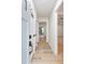 Bright entryway with light wood floors, new light-colored door and trim, and access to main living areas at 4059 Big Valley Trl, Stone Mountain, GA 30083