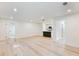 Spacious living room with new hardwood floors, recessed lights, and open access to kitchen and hallway at 4059 Big Valley Trl, Stone Mountain, GA 30083