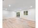 Bright, open living space with recessed lighting, new hardwood floors, and outdoor access to a deck at 4059 Big Valley Trl, Stone Mountain, GA 30083