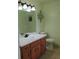 Bathroom featuring a vanity with a sink, mirror, and modern light fixture at 4814 Delgado Dr Sw, Lilburn, GA 30047
