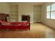 Spacious bedroom with decorative fireplace, built-in shelving, and lots of natural light at 4814 Delgado Dr Sw, Lilburn, GA 30047