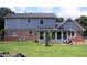View of the home's exterior, showcasing the well-maintained backyard at 4814 Delgado Dr Sw, Lilburn, GA 30047