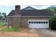 Spacious attached garage has ample room for storage and parking at 4814 Delgado Dr Sw, Lilburn, GA 30047