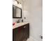 Small bathroom with updated vanity, granite countertop, and framed mirror at 401 Riverwalk, Mcdonough, GA 30252