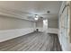 The open basement features new floors, wainscotting, a ceiling fan, and a door to the backyard at 650 Lake Forest Ct, Roswell, GA 30076