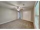Bedroom featuring neutral walls, carpet flooring, a ceiling fan, and a closet at 650 Lake Forest Ct, Roswell, GA 30076