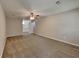 The main bedroom suite features neutral walls, new carpet, a ceiling fan, and an ensuite bathroom at 650 Lake Forest Ct, Roswell, GA 30076