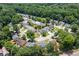 A neighborhood with houses nestled among lush green trees, creating a peaceful and secluded atmosphere at 7000 Foxberry Ln, Roswell, GA 30075