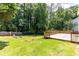 Spacious backyard with a large wooden deck perfect for entertaining or relaxing outdoors at 7000 Foxberry Ln, Roswell, GA 30075
