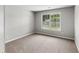 A bedroom featuring a large window at 7000 Foxberry Ln, Roswell, GA 30075