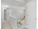 Well-lit hallway with natural light and carpeted floors at 7000 Foxberry Ln, Roswell, GA 30075