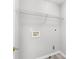 Laundry room with utility shelf and hookups for a washer and dryer at 7000 Foxberry Ln, Roswell, GA 30075