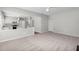 Open floor plan from living room into the kitchen with stainless appliances at 7000 Foxberry Ln, Roswell, GA 30075