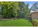 Spacious backyard with lush green grass, a privacy fence, and mature trees at 120 Timbervalley Ln, Lawrenceville, GA 30043