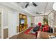 Finished basement with a TV, built-in shelves, and a cozy sitting area at 120 Timbervalley Ln, Lawrenceville, GA 30043