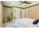 Comfortable bedroom featuring neutral colors, a ceiling fan, and an abundance of natural light at 120 Timbervalley Ln, Lawrenceville, GA 30043