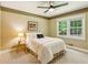 Bright bedroom featuring natural light, a ceiling fan and neutral color scheme at 120 Timbervalley Ln, Lawrenceville, GA 30043