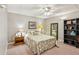 Bedroom with neutral walls, a ceiling fan, and a large bookcase at 120 Timbervalley Ln, Lawrenceville, GA 30043